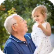 Grandfather holding his granddaughter