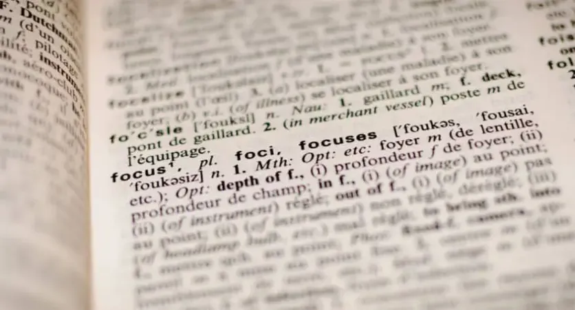Close-up of a dictionary page highlighting the definition of the word 'focus
