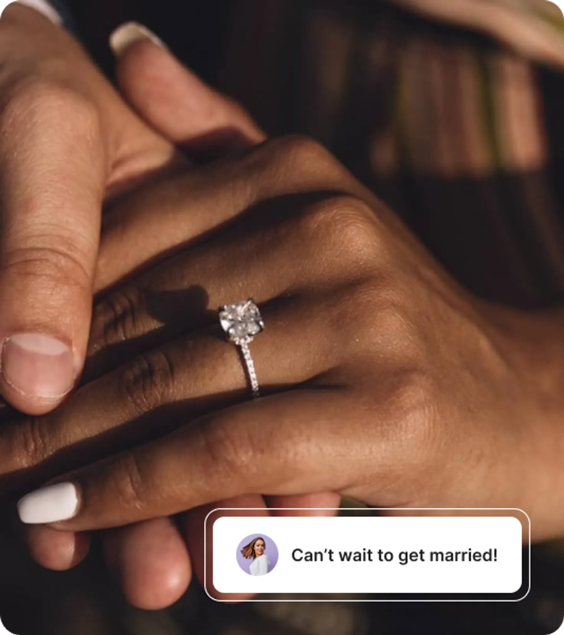 A close-up of a hand wearing a sparkling engagement ring, gently held by another hand, symbolizing an upcoming marriage.