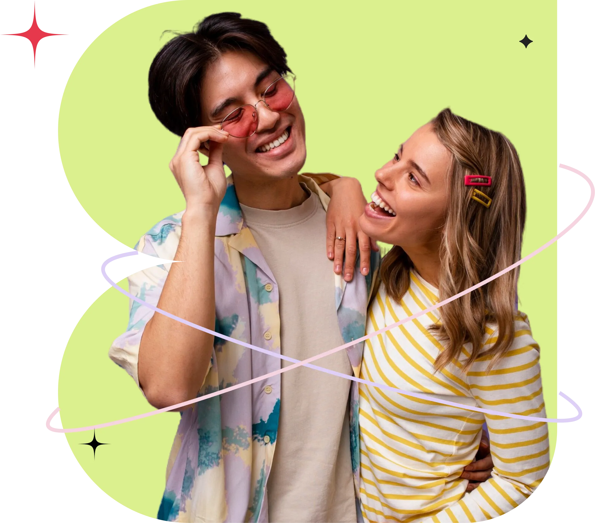 A young man and woman laughing together, dressed in colorful outfits with a playful graphic background.