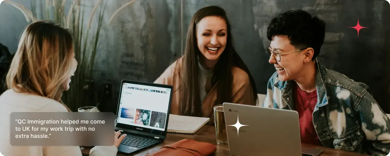 Three young adults smiling and working together with laptops in a modern coworking space, with a testimonial about immigration support displayed.