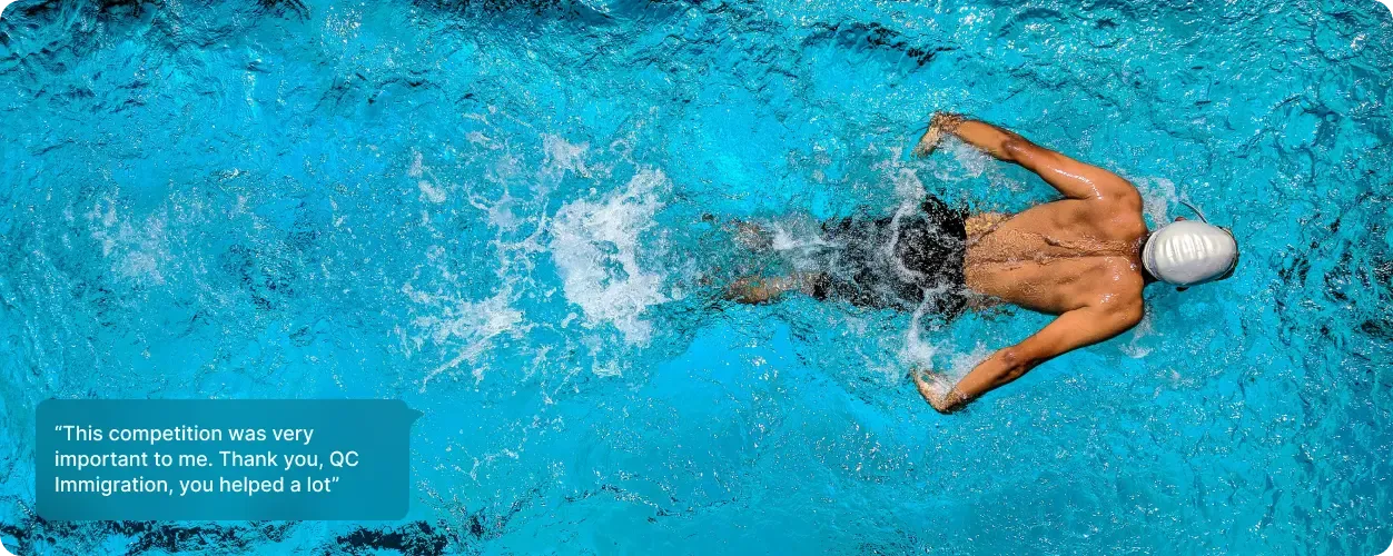 Male swimmer in pool mid-stroke, representing skilled professionals or athletes eligible for UK Specialist Worker Visas