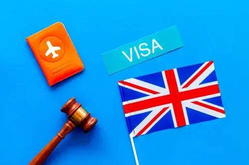 UK visa illustration with British flag, passport, visa sign, and gavel on blue background.